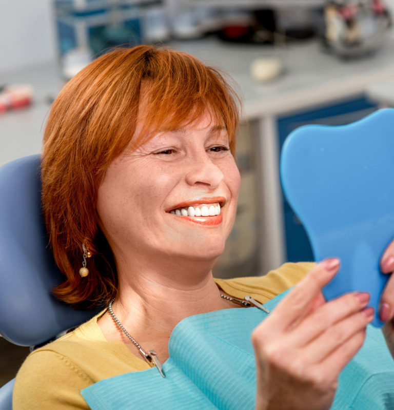 dental implants patient smiling after procedure