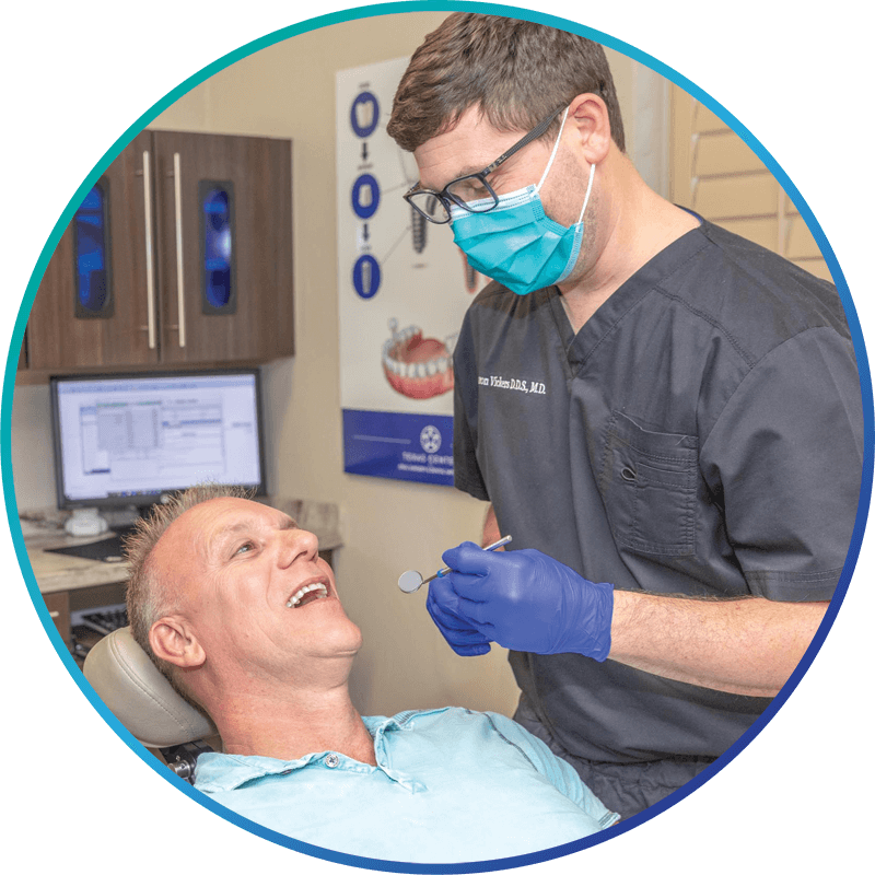 dr vickers performing dental procedure