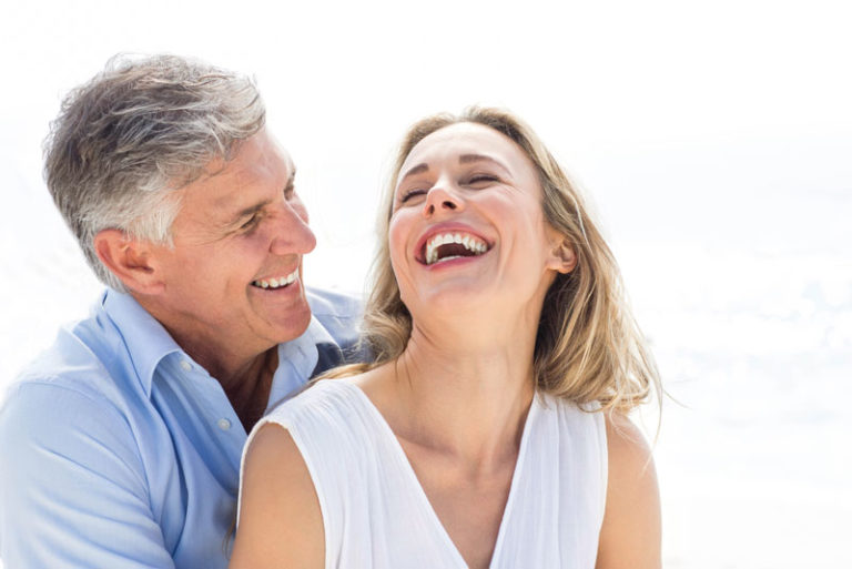 Two Dental Implant Patients Smiling Together
