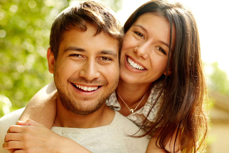 Dental Patients Smiling With Well Cared For Dental Implants In Denton, TX