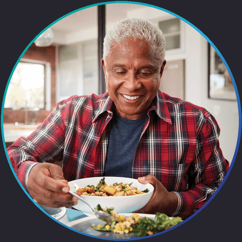 a patient eating after his successful dental implant procedure