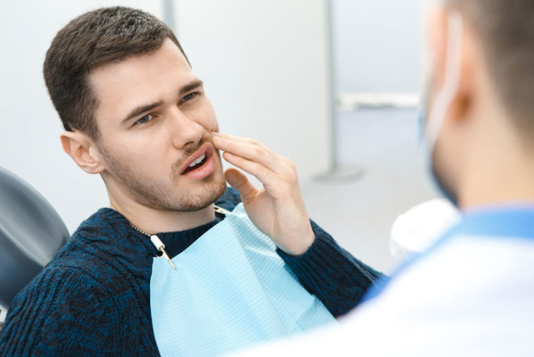 Dental Patient Suffering From Mouth Pain On A Dental Chair, In Denton, TX