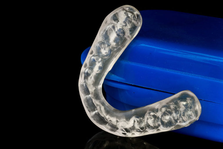 An image of a dental night guard to treat TMJ disorder