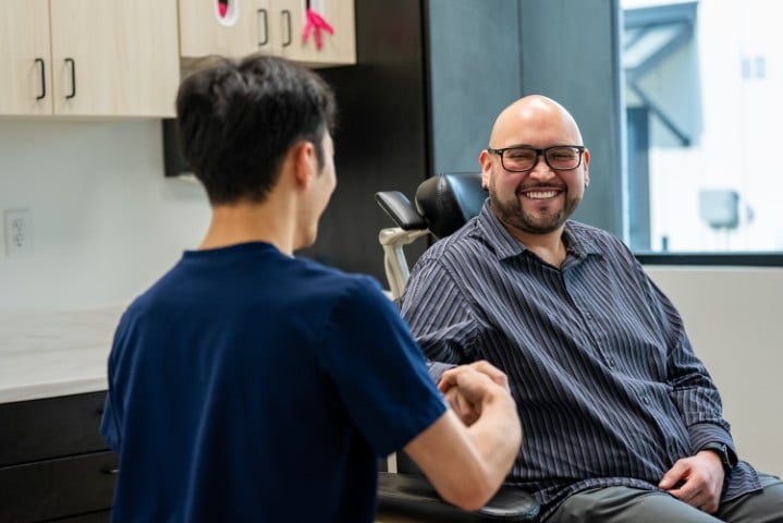 Patient smiling after discussing his full mouth dental implants in Allen TX.