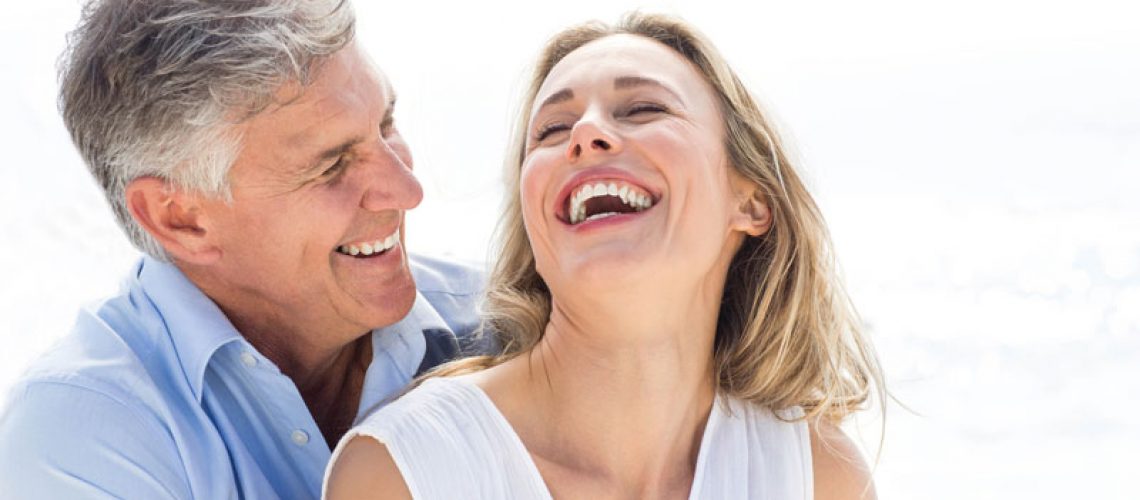 Two Dental Implant Patients Smiling Together
