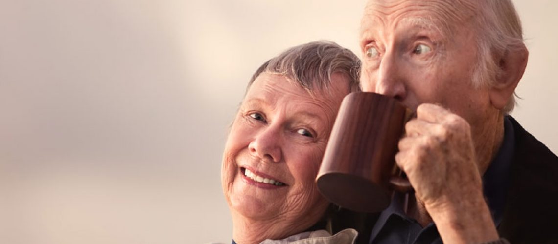 Dental Implant Patients Smiling And Drinking Coffee