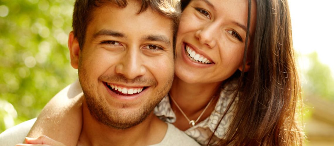 Dental Patients Smiling With Well Cared For Dental Implants In Denton, TX