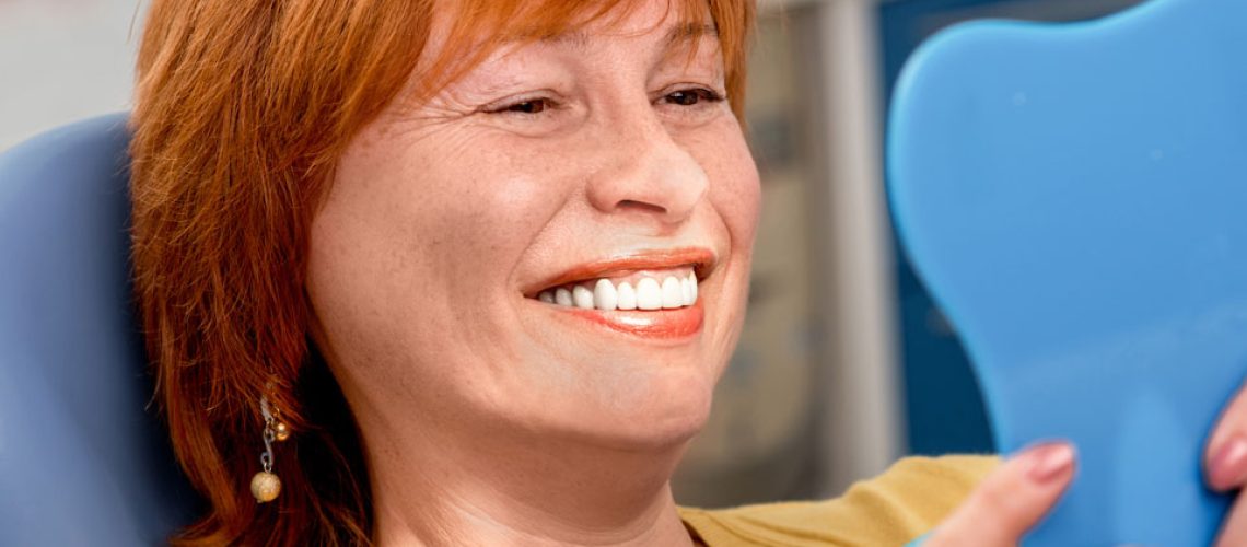 dental implants patient smiling after procedure
