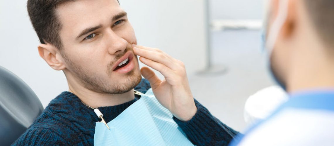 Dental Patient Suffering From Mouth Pain On A Dental Chair, In Denton, TX